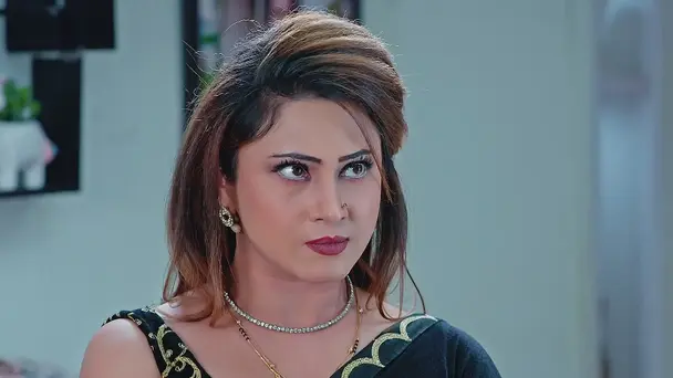 Mannu Inspects a File in Sheetal's Room