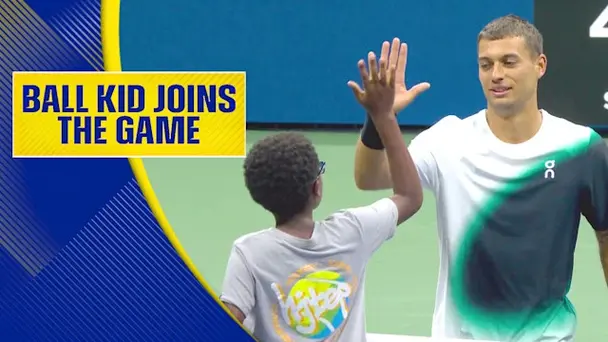 Ball Kid Plays Tennis with Cobolli