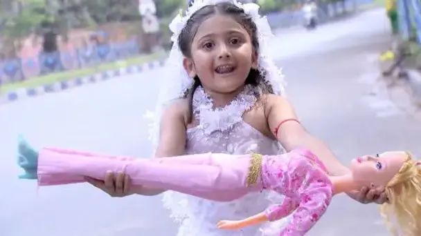 Jhumur runs to return the doll